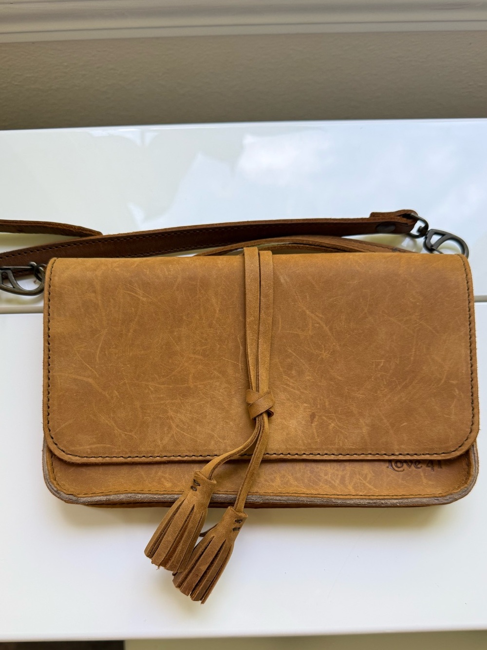 Saddleback Leather Love 41 multi-use clutch with crossbody and wristlet strap